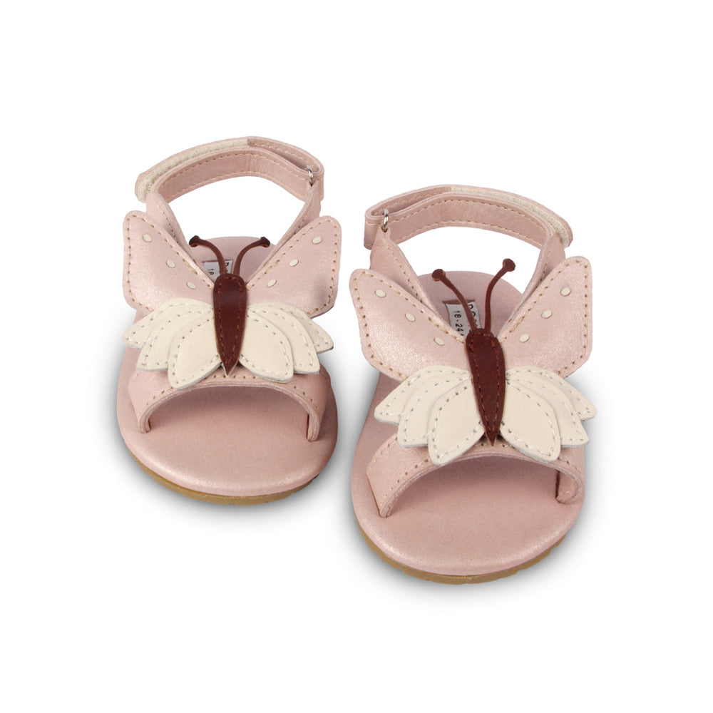 Brand: Donsje Colour: pastel pink. Details: Handmade & Fairtrade, Adjustable velcro fastening strap Anti slip suede outsole (size: 0-6 & 6-12 months),  Rubber flexible sole (size: 12-18 & 18-24 months) Composition:  100% Premium leather *** Donsje donates a part of its profits to the Shining Star foundation in Kenya.