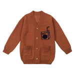 Nadadelazos brown knitted cardigan with fun Intarsia motive "Juice" pack at front and ' Ilove juice' logo at the back, V neck, Coconut buttons at the front, Little patch pockets at front.  Composition: 50% Merino wool, 50% Polyamide Made in: Spain
