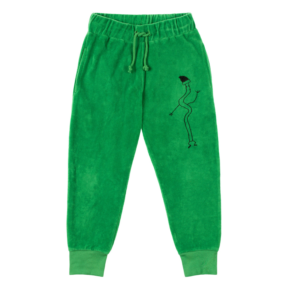 Brand: Nadadelazos Colour: Broccoli Green Details: Unisex, Jogging pant with local print "Spaguetti",  Casing at waist with a cotton cord belt, Rib cuffs.  Composition: 100% organic cotton velour Made in: India Care: Machine wash 30 degree max, Do not dry clean, Do not tumble dry, Cold iron on the reverse side, Do not bleach.
