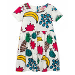 Brand: Nadadelazos Colour: Rice Ivory Details: Dress with gathered seam at waist and fun allover print FRUIT MIX!, All sizes have an opening with buttons at centre back. Composition: 100% organic cotton jersey/150GSM Made in: India