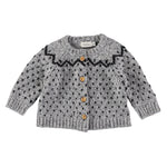 Búho Jacquard baby cardigan, Soft grey wool with a lovely contrasting charcoal zig zag and polka dot pattern. Round neckline, Long sleeves, Front buttons, Ribbed edges, Soft touch Composition: 39% Polyamide, 25% Wool, 22% Baby alpaca, 9% Viscose, 5% Silk Made in: Spain