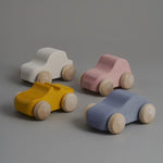 Toy cars in beige, silver and mustard colours. Brand: Raduga Grëz Composition: Lime wood  Made in: Russia The shades may differ from the shades on the screen. Tree-specific spots or streaks of wood are possible. Details and size may vary slightly as this is handmade. 